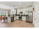 Bright eat-in kitchen features stainless steel appliances, granite countertops, and white cabinetry at 8002 Mariners Pointe Cir, Denver, NC 28037