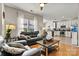 Bright living room with hardwood floors, and a view to the kitchen at 8002 Mariners Pointe Cir, Denver, NC 28037