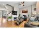 Inviting living room features a fireplace, ceiling fan, and hardwood flooring at 8002 Mariners Pointe Cir, Denver, NC 28037