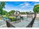 Community pool with lounge chairs and a well-manicured lawn, perfect for relaxation and recreation at 8002 Mariners Pointe Cir, Denver, NC 28037