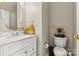 Well-maintained powder room featuring a vanity with a stylish sink and fixtures at 8002 Mariners Pointe Cir, Denver, NC 28037