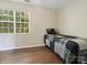Bedroom featuring wood-look floors and a window with lots of natural light at 8030 Glencannon Dr, Charlotte, NC 28227