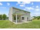 Back exterior view of home featuring a covered patio and a spacious backyard at 8400 Empress Ct, Charlotte, NC 28227