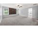 Spacious bedroom with carpet floors, ceiling fan and natural light from two windows at 8400 Empress Ct, Charlotte, NC 28227