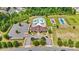 Aerial view of the community pool, clubhouse, and playground in a suburban neighborhood at 8400 Empress Ct, Charlotte, NC 28227
