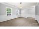 Spacious dining room with wood floors, trim, and lots of natural light at 8400 Empress Ct, Charlotte, NC 28227
