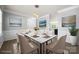 Bright dining room featuring a marble table, modern lighting and elegant wall art at 8400 Empress Ct, Charlotte, NC 28227
