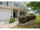 Charming home exterior showcasing manicured landscaping and a welcoming covered porch at 8400 Empress Ct, Charlotte, NC 28227