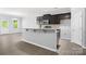 Contemporary kitchen featuring a center island, and stainless steel appliances at 8400 Empress Ct, Charlotte, NC 28227