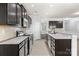 Beautiful kitchen with granite countertops, stainless steel appliances and dark wood cabinets at 8400 Empress Ct, Charlotte, NC 28227