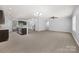 Open-concept living space integrates kitchen, dining, and living areas for modern living at 8400 Empress Ct, Charlotte, NC 28227