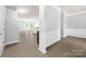 An open concept with modern wood flooring, white trim, and neutral gray paint at 8400 Empress Ct, Charlotte, NC 28227