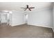Spacious living room with staircase entry and views into other living areas at 8400 Empress Ct, Charlotte, NC 28227