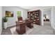 Office space featuring a large desk, bookcase, and an open doorway to the bedroom at 8400 Empress Ct, Charlotte, NC 28227