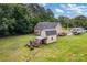 Aerial view of the home, backyard, shed, and open space at 8632 Island Point Rd, Sherrills Ford, NC 28673