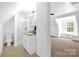 Bright bathroom with stand-up shower, and neutral color palette near a large bedroom at 8632 Island Point Rd, Sherrills Ford, NC 28673