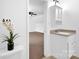Upstairs bathroom with a vanity and view of a bedroom at 8632 Island Point Rd, Sherrills Ford, NC 28673