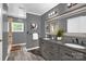 Elegant bathroom with dual vanities, granite countertops, decorative mirrors and stone accents at 8632 Island Point Rd, Sherrills Ford, NC 28673