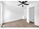 Bright bedroom with a ceiling fan, closet, and neutral carpet at 8632 Island Point Rd, Sherrills Ford, NC 28673