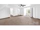 Spacious bedroom with neutral carpet, and a window seat with a picturesque backyard view at 8632 Island Point Rd, Sherrills Ford, NC 28673