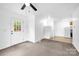 Large bonus room with neutral walls, carpet, and a door to the back yard at 8632 Island Point Rd, Sherrills Ford, NC 28673