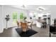 Bright eat-in kitchen featuring modern cabinetry, an island with seating, and a dining area with outdoor access at 8632 Island Point Rd, Sherrills Ford, NC 28673