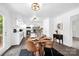 Cozy eat-in kitchen features a circular dining table, modern cabinetry, and ample natural light at 8632 Island Point Rd, Sherrills Ford, NC 28673