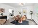 Cozy dining room with a stylish round table, seating for four, and view to living room at 8632 Island Point Rd, Sherrills Ford, NC 28673