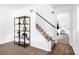 Inviting entryway featuring stairs and modern shelving, leading to a bedroom, with wood-look floors at 8632 Island Point Rd, Sherrills Ford, NC 28673