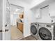 Convenient laundry room with modern washer and dryer, with door to kitchen and additional shelving at 8632 Island Point Rd, Sherrills Ford, NC 28673