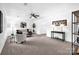 Spacious living room featuring ample seating, soft carpet, modern furniture, and a ceiling fan at 8632 Island Point Rd, Sherrills Ford, NC 28673