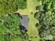 Aerial view of a home nestled among mature trees and well-maintained lawns at 967 Hilldale Dr, Lancaster, SC 29720