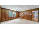 Bedroom featuring classic wood paneled walls and neutral carpet at 967 Hilldale Dr, Lancaster, SC 29720