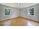 Inviting bedroom with hardwood flooring, neutral paint, and abundant natural light from the windows at 967 Hilldale Dr, Lancaster, SC 29720