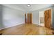 Cozy bedroom with hardwood flooring and doors leading to additional rooms at 967 Hilldale Dr, Lancaster, SC 29720