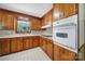 Traditional kitchen featuring wood cabinets, a white oven, and natural lighting at 967 Hilldale Dr, Lancaster, SC 29720