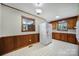 Spacious kitchen with wood trim, white appliances, and large windows providing natural light at 967 Hilldale Dr, Lancaster, SC 29720