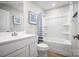 A clean, bright bathroom offers a white vanity and tub shower with tile surround at 10127 Florentine Way, Charlotte, NC 28214