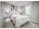 Cozy bedroom showcases a comfortable bed and window with bright natural light at 10127 Florentine Way, Charlotte, NC 28214