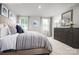 Inviting bedroom features plush carpet, a large window, and comfortable furnishings with modern decor at 10127 Florentine Way, Charlotte, NC 28214