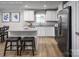 Bright kitchen featuring stainless steel appliances, granite countertops, a breakfast bar and modern cabinetry at 10127 Florentine Way, Charlotte, NC 28214