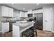 Bright kitchen featuring stainless steel appliances, granite countertops, a breakfast bar and modern cabinetry at 10127 Florentine Way, Charlotte, NC 28214