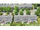 Aerial view of rooftops and neighborhood showcasing well-maintained landscaping at 10225 Alexander Martin Ave, Charlotte, NC 28277