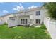 Spacious backyard with green grass, patio, and fencing at 10225 Alexander Martin Ave, Charlotte, NC 28277