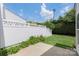 Fenced backyard with grass and small patio provides a secure and private outdoor space at 10225 Alexander Martin Ave, Charlotte, NC 28277