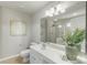 A well-lit bathroom features a vanity, and plant on the countertop at 10225 Alexander Martin Ave, Charlotte, NC 28277