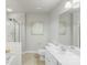 A full bathroom features a shower over tub and single sink vanity at 10225 Alexander Martin Ave, Charlotte, NC 28277
