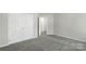 A cozy bedroom offering carpet floors and a closet at 10225 Alexander Martin Ave, Charlotte, NC 28277