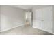A neutral bedroom featuring a plush carpet and a closet at 10225 Alexander Martin Ave, Charlotte, NC 28277