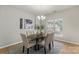 Elegant dining room with modern chandelier and a view to the kitchen at 10225 Alexander Martin Ave, Charlotte, NC 28277